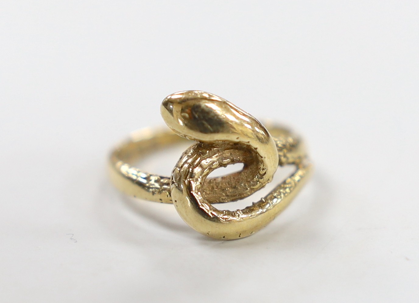 A 1970's? 9ct gold entwined serpent ring, size J, 3.3 grams.